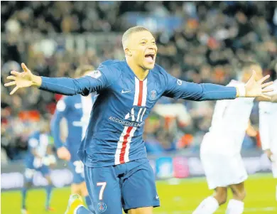  ??  ?? Paris Saint-Germain’s Kylian Mbappe celebrates after scoring his side’s fourth goal during their French Ligue 1 match against Dijon, at the Parc des Princes stadium in Paris, France, on Saturday, February 29.