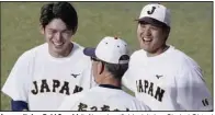  ?? (AP/Kyodo News) ?? Japan pitcher Roki Sasaki (left) and outfielder/pitcher Shohei Ohtani (right) share a light moment during a practice Friday in Nagoya, Japan. Sasaki, who will pitch in the World Baseball Classic, is regarded as the next big thing in baseball out of Japan.