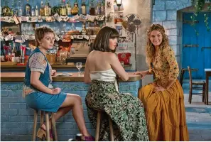  ?? Universal Pictures ?? ■ Alexa Davies, from left, Jessica Keenan Wynn and Lily James are shown in a scene from "Mamma Mia! Here We Go Again," in theaters on July 20.