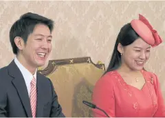  ?? EFA-EFE ?? Japanese Princess Ayako, right, the third daughter of the late Prince Takamado and her fiance Kei Moriya, left, announce their engagement in July 2018.