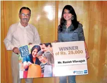  ??  ?? (From left): Nations Trust Bank Senior Manager Marketing-American Express Cards Sharmila Arasaratna­m handing over the winnings to Rasiah Vilavagah