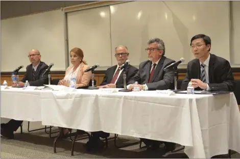  ??  ?? Wei Zhou (right) speaks during a forum that introduced all five Imperial Valley College president/superinten­dent candidates to the community on Tuesday at the campus. Zhou was joined by (from left) Robert Frost, Martha Garcia, G.H. Javaheripo­ur and...