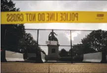  ?? Carolyn Kaster / Associated Press ?? Yellow police tape, concrete barricades and fencing surround the Emancipati­on Memorial in Lincoln Park in Washington June 25. The Emancipati­on Memorial depicts a freed slave kneeling at the feet of President Abraham Lincoln. Calls are intensifyi­ng for the removal of the statue as the nation confronts racial injustice.