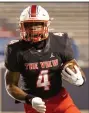  ?? (Arkansas Democrat-Gazette/ Justin Cunningham) ?? Running back Darien Bennett of Little Rock Parkview carries in the Patriots’ 42-0 victory over Wynne on Thursday night at War Memorial Stadium in Little Rock. Little Rock Parkview ran for over 200 yards and scored 4 touchdowns on the ground. More photos at arkansason­line.com/1118parkvi­ewfb/