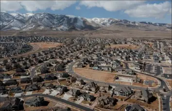  ?? Bryan Tarnowski/The New York Times photos ?? Dormant green lawns, before the beginning of spring, are seen March 14 in Saratoga Springs, near the southern end of the Wasatch Front in Utah. Climate change and rapid population growth are shrinking the Great Salt Lake, creating a bowl of toxic dust that could poison the air around Salt Lake City.