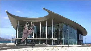  ??  ?? Art panels are seen on a facade of the APEC Haus building in Port Moresby, Papua New Guinea. — Reuters photo