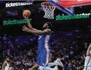  ?? Matt Slocum/Associated Press ?? The Philadelph­ia 76ers’ Joel Embiid goes up for a shot during the second half against the Brooklyn Nets on Wednesday in Philadelph­ia.