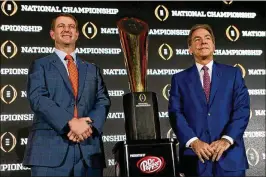  ?? BRIAN BLANCO / GETTY IMAGES ?? Clemson coach Dabo Swinney (left), who has roots in Alabama, could be tempted to return home when and if Nick Saban leaves the Crimson Tide. Saban has won five national titles at Alabama. Swinney has one at Clemson.