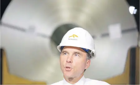  ??  ?? Finance Minister Bill Morneau tours one of ArcelorMit­tal Dofasco's galvanizin­g steel mills in Hamilton, Ont.