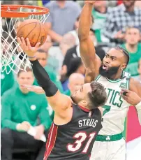  ?? AP PHOTO ?? Miami Heat’s Max Strus (31) shoots against Boston Celtics’ Jaylen Brown (7) during the second half of Game 3 of the NBA basketball Eastern Conference finals playoff series Saturday, May 21, 2022, in Boston.