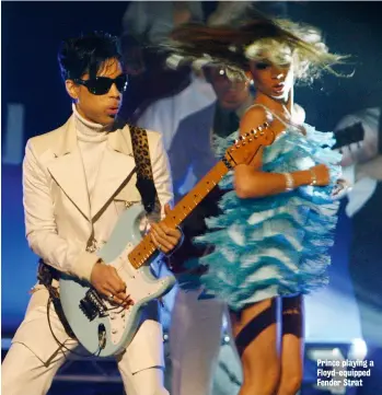  ??  ?? Prince playing a Floyd-equipped Fender Strat