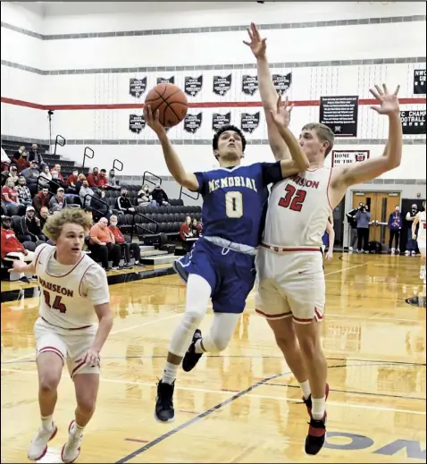  ?? Photo by John Zwez ?? LeTrey Williams of St. Marys goes up for a shot during Wednesday’s game against Wauseon as Isaac Wilson of the Indians applies defensive pressure. Also pictured for Wauseon is Kolton DeGroff.