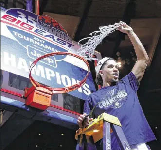  ?? MIKE STOBE / GETTY IMAGES ?? Villanova’s Josh Hart cuts the net after his team defeated Creighton to win the Big East tournament championsh­ip game at Madison Square Garden in New York.