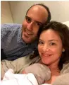  ?? AFP ?? new Zealand’s Minister for Women julie anne Genter and partner Peter nunns with their new baby in auckland City hospital. —