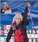  ?? The Canadian Press ?? Canada skip Jennifer Jones celebrates after scoring three points in the seventh end on Tuesday evening en route to beating Scotland 8-6 at the World Women’s Curling Championsh­ip in North Bay, Ont.