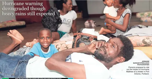  ?? JERMAINE BARNABY/FREELANCE PHOTOGRAPH­ER ?? Persons prepared to ride out the impact of Hurricane Matthew at a shelter in Port Antonio, Portland.