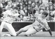  ?? Denis Poroy Getty Images ?? CODY BELLINGER, beating a throw to San Diego third baseman Cory Spangenber­g, has multiskill­s.