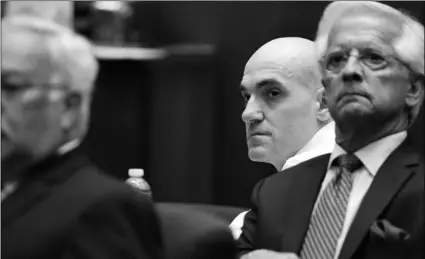  ?? LUCY NICHOLSON, POOL PHOTO VIA AP ?? Michael Gargiul, (center) sits in front of his attorneys, Daniel Nardoni (right) and Dale Rubin during a court appearance on Tuesday, in Los Angeles.