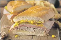  ??  ?? Medianoche, a Cuban-style sandwich, is a great way to use up leftover roast pork.