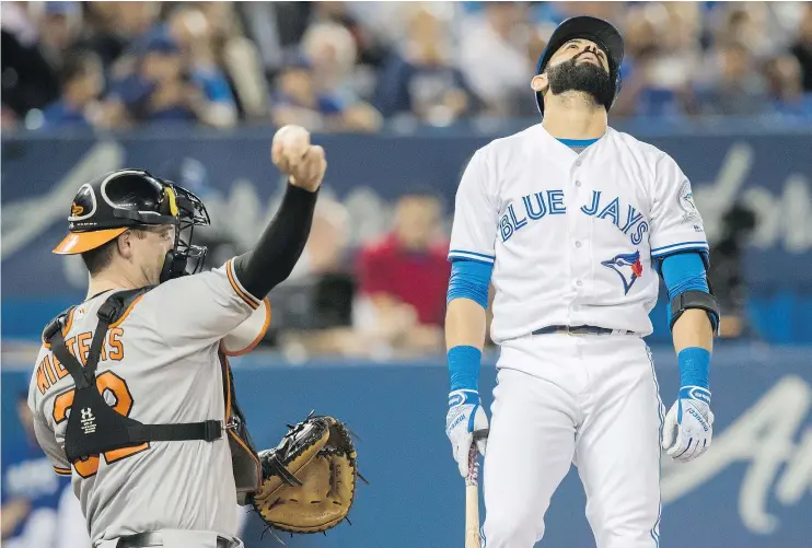  ??  ?? Toronto Blue Jays’ Jose Bautista reacts after striking out against the Baltimore Orioles Thursday at Rogers Centre in Toronto. The O’s shut out the Jays 4-0.