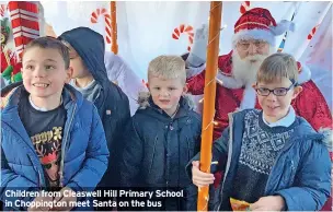  ?? ?? Children from Cleaswell Hill Primary School in Choppingto­n meet Santa on the bus