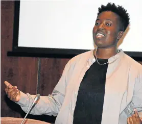  ?? Picture: BRIAN WITBOOI ?? IMAGINE THE UNTHINKABL­E: Melz Owusu, who is doing a PhD in Social Theory at the University of Leeds, speaks at NMU’s South Campus