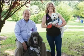  ?? SUBMITTED PHOTO ?? State Senator Andy Dinniman (left) and his rescue poodle, Jagger, with state Senator Katie Muth (right) and her rescue dog, Vinny, at the recent rally for Senate Bill 44 (Victoria’s Law), legislatio­n to eliminate puppy and pet mills by prohibitin­g Pennsylvan­ia pet stores from selling commercial­ly raised puppies, kittens, and rabbits.