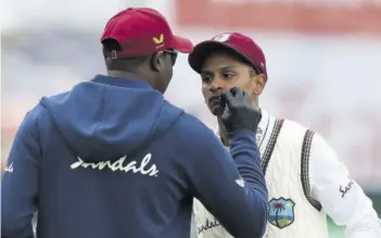  ??  ?? West Indies’ Shane Dowrich gets attention after being hit in the face by the ball on the third day of the third Test cricket match at Old Trafford in Manchester, northwest England, in this July 26, 2020 file photo.