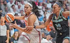  ?? DAY FILE PHOTO ?? Connecticu­t Sun center Brionna Jones (42) drives the lane against Chicago Sky forward Azurá Stevens (30) during a 2022 WNBA playoff game at Mohegan Sun Arena.