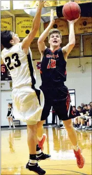  ?? Photo by Mike Eckels ?? With the Gravette Lions down by 12 with two minutes left in the contest, Kelton Trembly (12) puts up a jumper as Pottville’s Samuel Dunlap (23) defends during the first round of the 4A North Regional basketball tournament at the Tiger Dome in West Fork...