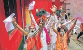  ?? PTI ?? Sadhus chant religious slogans while standing in a queue to get themselves registered for Amarnath ■
Yatra at a base camp, in Jammu on Wednesday.