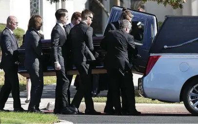  ?? Photos by Bob Owen / San Antonio Express-News ?? Pallbearer­s carry Charline McCombs to a hearse following the memorial service at Alamo Heights United Methodist Church.