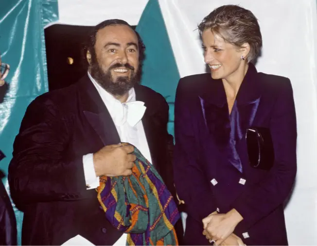  ??  ?? Despite being rain-soaked, the Princess of Wales shines (above) as she meets tenor Luciano Pavarotti at the London special Pavarotti in the Park in July 1991, her hair – created by Nicky – ruined by the downpour (right). “I like to think it lasted long before it collapsed,” Nicky says