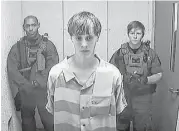  ?? Centralize­d Bond Hearing Court, Charleston, S.C. via Associated Press ?? Dylann Roof appears by video Friday before a judge who set bail at $1 million on a gun charge. The state’s Circuit Court will handle Roof ’s murder charges.