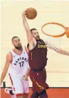  ?? GRANK GUNN/ASSOCIATED PRESS ?? Cleveland’s Kevin Love (0) prepares to slam home two points at Toronto on Thursday.