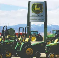  ?? RICK WILKING / REUTERS FILES ?? Investors cheered John Deere’s decision to control costs, sending stock shares up close to four per cent on Friday.