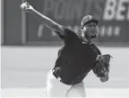  ?? JUNFU HAN/DETROIT FREE PRESS ?? Detroit Tigers pitcher Ivan Nova throws during training camp at Comerica Park in Detroit on Tuesday.