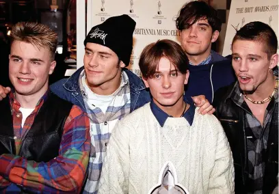  ?? Neil Munns/PA ?? ● Gary Barlow, Howard Donald, Mark Owen, Robbie Williams and Jason Orange of Take That at the Hard Rock Cafe in London in 1993
