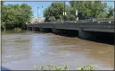  ?? ?? The Schuylkill River was running high Thursday, Sept. 2, 2021, under the Hanover Street bridge between Pottstown and North Coventry.