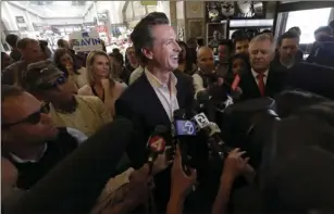  ?? AP PHOTO/JEFF CHIU ?? Lt. Gov. Gavin Newsom laughs during an interview with reporters while campaignin­g for governor at the Ferry Building Marketplac­e in San Francisco on Wednesday.