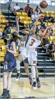  ??  ?? North Point sophomore guard Latavia Jackson floats a shot up over the Catonsvill­e defense in Thursday afternoon’s Class 4A state semifinals at Towson University’s SECU Arena.