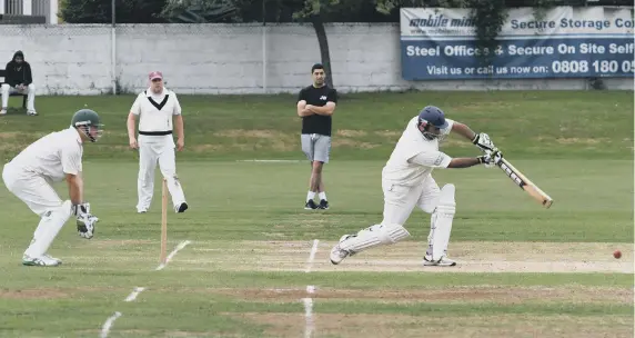  ??  ?? Philadelph­ia wicket-keeper Paul Hollinshea­d looks on as Whiteleas batsman Hafiz Aleem plays a shot last Saturday.