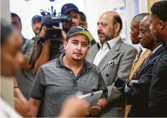  ?? Jon Shapley / Staff photograph­er ?? Gumaro Campos, center, arrives at court Tuesday. Campos is accused of selling alcohol to Jaggar Clayton Smith, 17, who is charged with two counts of intoxicati­on manslaught­er.