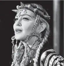  ?? Angela Weiss / AFP / Getty Images ?? Madonna’s new video for her anti-gun anthem “God Control” is being praised by some and criticized by others for its graphic depiction of a mass shooting in a nightclub.