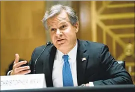  ?? Greg Nash Pool Photo ?? FBI DIRECTOR Christophe­r A. Wray testifies last week in Washington.