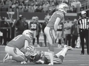  ?? Michael Ainsworth Associated Press ?? CHARGERS KICKER Nick Novak said it “didn’t feel good at all” when he missed this field goal attempt from 35 yards in the first quarter. Holder Kellen Clemens and the Cowboys Anthony Brown watch it go wide.