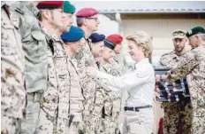  ?? — AFP ?? German Defence Minister Ursula von der Leyen awards soldiers for their service during a medal ceremony at Camp Marmal military base in Mazar-i-sharif on Sunday.