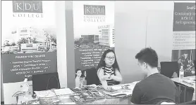  ??  ?? EduQuest Education Fair – a student getting informatio­n from a university representa­tive.