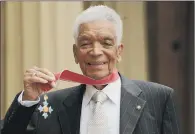  ?? PICTURE: GETTY. ?? PIONEER: Actor Earl Cameron poses outside Buckingham Palace in 2009 with his CBE, presented by the Prince of Wales.
