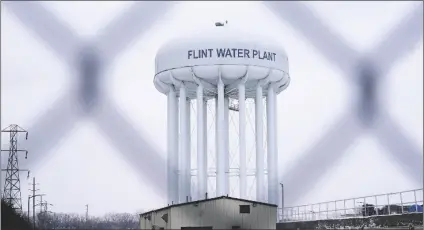  ?? CARLOS OSORIO/AP ?? THE FLINT WATER PLANT TOWER is seen on Jan. 6 in Flint, Mich.